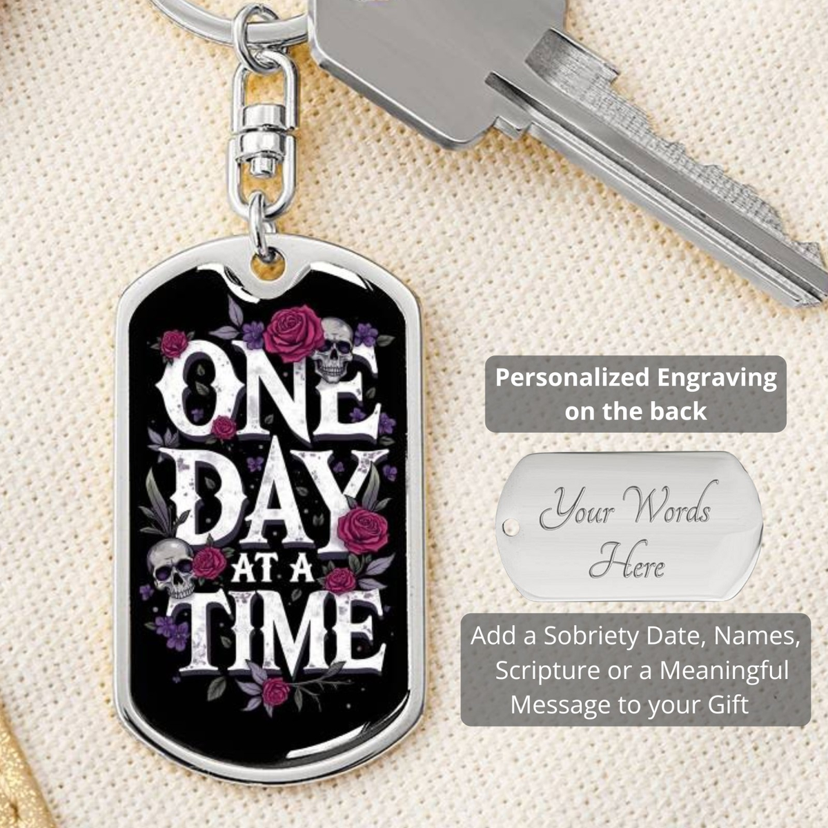 Silver dog tag keychain front with “One Day At A Time” design and back engraving panel