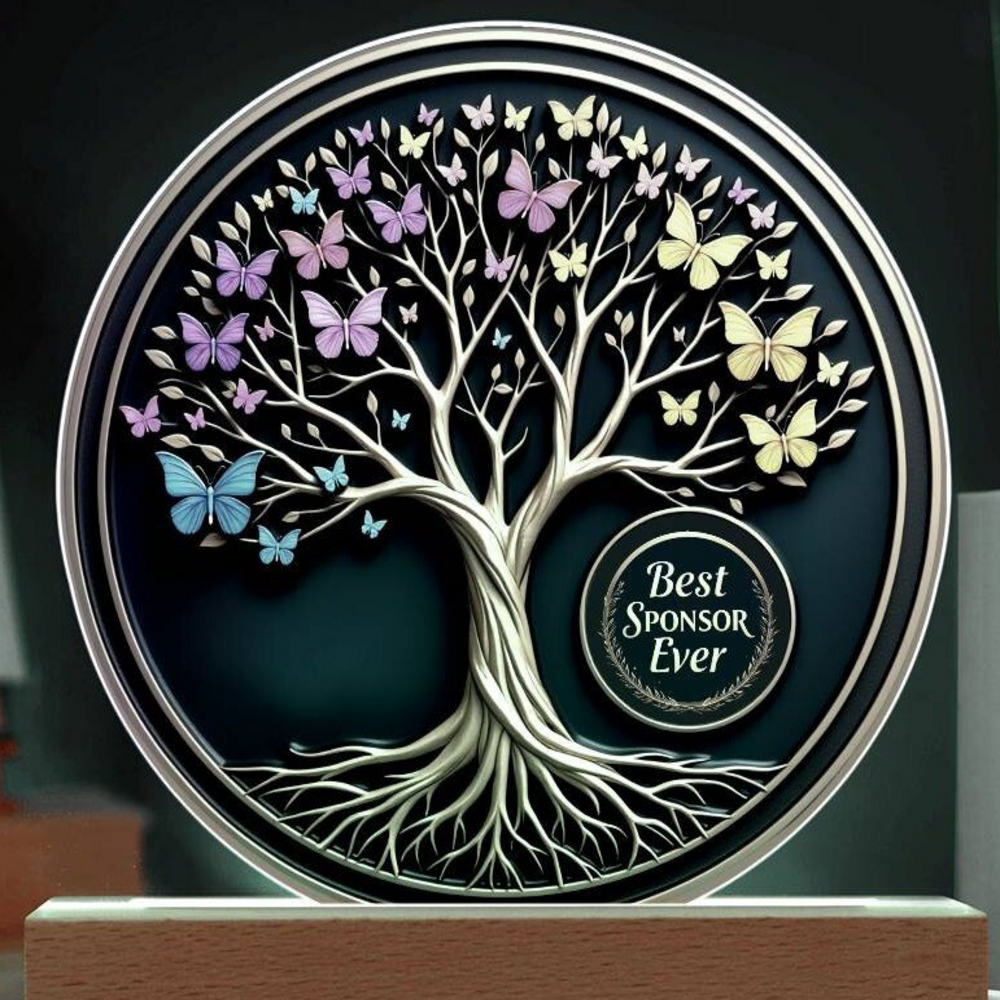 LED circle acrylic keepsake close-up with white tree, multicolor butterflies, and sponsor badge
