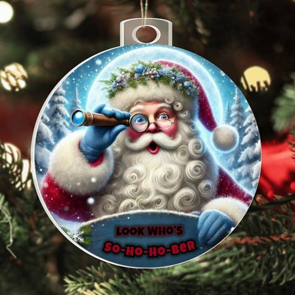 Large round Santa ornament with blue telescope and red “So-Ho-Ho-Ber” lettering